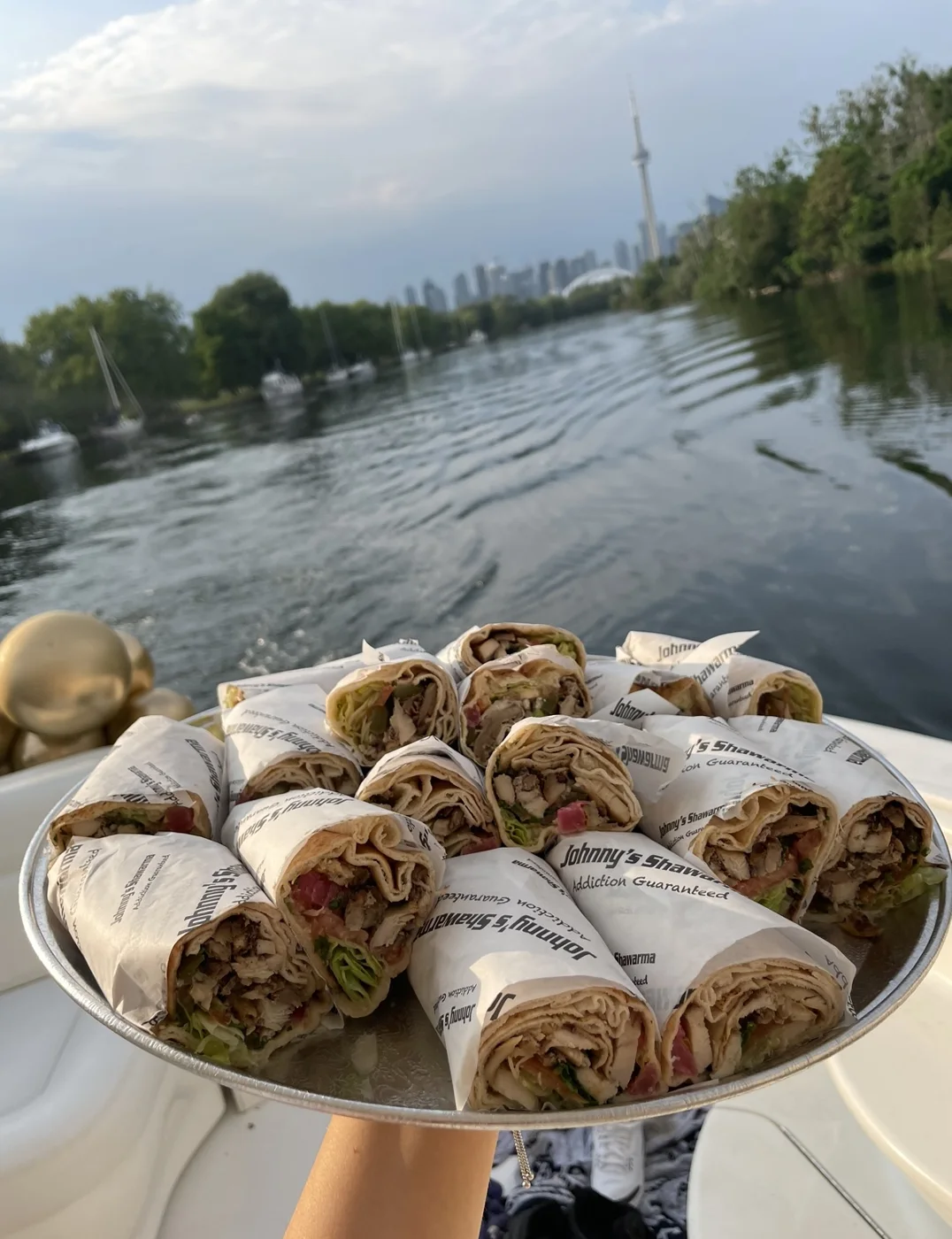 A platter of Johnny’s wraps out on the water